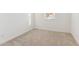 Empty bedroom with neutral carpet, a window, and electrical outlets at 4342 E Enmark Dr, San Tan Valley, AZ 85143