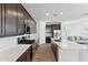Contemporary kitchen with stainless steel appliances and island overlooking the living area at 4342 E Enmark Dr, San Tan Valley, AZ 85143