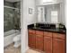 Modern bathroom with dark countertop vanity at 4950 N Miller Rd # 130, Scottsdale, AZ 85251