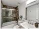 Updated bathroom with stone shower surround and modern vanity at 4950 N Miller Rd # 130, Scottsdale, AZ 85251