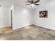Bright bedroom with tile floors and ceiling fan at 4950 N Miller Rd # 130, Scottsdale, AZ 85251
