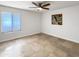Bright bedroom with tile floors and ceiling fan at 4950 N Miller Rd # 130, Scottsdale, AZ 85251