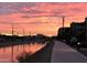 Scenic sunset view over the canal and walking path at 4950 N Miller Rd # 130, Scottsdale, AZ 85251