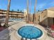 Community hot tub with surrounding lounge chairs at 4950 N Miller Rd # 130, Scottsdale, AZ 85251