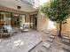 Private patio with seating and small tree at 4950 N Miller Rd # 130, Scottsdale, AZ 85251