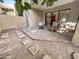 Private patio with brick pavers and seating area at 4950 N Miller Rd # 130, Scottsdale, AZ 85251