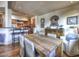 Bright dining area with a rustic wooden table and comfortable seating at 5101 N Casa Blanca Dr # 206, Paradise Valley, AZ 85253