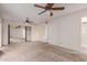 Primary bedroom with mirrored closet doors and ceiling fan at 543 W Pampa Ave, Mesa, AZ 85210