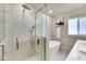 Beautiful bathroom featuring a glass shower, soaking tub, and modern fixtures at 545 W Windsor Ave, Phoenix, AZ 85003