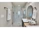 Chic bathroom showcasing glass shower, neutral color palette, and modern fixtures at 545 W Windsor Ave, Phoenix, AZ 85003