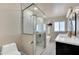 Modern bathroom featuring a glass shower, soaking tub, double sinks, and marble accents at 545 W Windsor Ave, Phoenix, AZ 85003