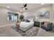 Cozy bedroom with neutral decor, large window, and comfortable furnishings at 545 W Windsor Ave, Phoenix, AZ 85003