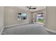 Spacious bedroom with ample natural light, neutral carpet, and yard access at 545 W Windsor Ave, Phoenix, AZ 85003