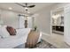 Bedroom featuring ensuite bathroom, barn doors, and neutral carpet at 545 W Windsor Ave, Phoenix, AZ 85003