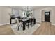 Elegant dining room with a modern chandelier and neutral decor at 545 W Windsor Ave, Phoenix, AZ 85003