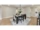 Inviting dining room featuring a modern light fixture and a stylish table setting on a decorative rug at 545 W Windsor Ave, Phoenix, AZ 85003