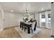 Elegant dining room boasts modern lighting and a stylish table setting on a decorative rug at 545 W Windsor Ave, Phoenix, AZ 85003