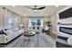 Bright living room with stylish furniture, modern fireplace, and a ceiling fan at 545 W Windsor Ave, Phoenix, AZ 85003