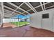 Covered patio overlooking backyard, with a view of artificial grass at 545 W Windsor Ave, Phoenix, AZ 85003