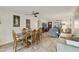Charming dining room with wood table and chairs, and access to living room at 633 S 77Th St, Mesa, AZ 85208