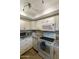 Modern kitchen with white cabinets, granite counters, and stainless steel appliances at 633 S 77Th St, Mesa, AZ 85208