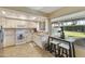 Modern kitchen featuring white cabinets, granite countertops, and stainless steel appliances at 633 S 77Th St, Mesa, AZ 85208