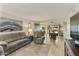 Bright living room with tiled floors, comfortable seating, and access to dining area at 633 S 77Th St, Mesa, AZ 85208