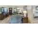 Spacious living room with plush seating and view into bedroom at 633 S 77Th St, Mesa, AZ 85208