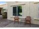 Private patio with wrought iron chairs and small table at 633 S 77Th St, Mesa, AZ 85208