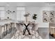Modern dining area with glass table and four chairs at 6502 N Central Ave # B104, Phoenix, AZ 85012