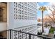 Building exterior with pool and lush landscaping at 6502 N Central Ave # B104, Phoenix, AZ 85012