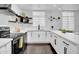 Modern white kitchen with stainless steel appliances at 6502 N Central Ave # B104, Phoenix, AZ 85012