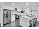 Modern kitchen with white cabinets and marble island at 6502 N Central Ave # B104, Phoenix, AZ 85012