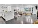 Open concept living and kitchen area with gray floors and white cabinets at 6502 N Central Ave # B104, Phoenix, AZ 85012