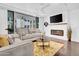 Spacious living room with fireplace and patio access at 6502 N Central Ave # B104, Phoenix, AZ 85012
