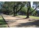 Scenic walking path with mature trees, offering a tranquil outdoor experience along green spaces at 6502 N Central Ave # B104, Phoenix, AZ 85012
