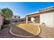 Covered patio overlooks a grassy backyard at 7589 W Claremont St, Glendale, AZ 85303