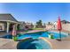 Inviting pool with spa, grassy area, colorful umbrellas and lounge chairs for the ultimate outdoor enjoyment at 7810 W Beryl Ave, Peoria, AZ 85345