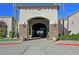 Inviting community entrance with stone accents and landscaping at 8352 W Rosemonte Dr, Peoria, AZ 85382