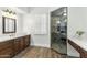 Elegant bathroom with dual vanities and a glass shower at 10102 E Saddle Horn Trl, Scottsdale, AZ 85255