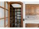 Well-organized pantry with ample shelving at 10102 E Saddle Horn Trl, Scottsdale, AZ 85255