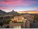 Stunning sunset view from private rooftop deck with seating area at 10102 E Saddle Horn Trl, Scottsdale, AZ 85255