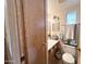 Clean bathroom with sink, toilet, and storage at 1027 S Prospector Dr, Apache Junction, AZ 85119