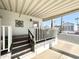 Covered porch with white railings and storage at 1027 S Prospector Dr, Apache Junction, AZ 85119