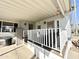 Covered porch with white railings and storage at 1027 S Prospector Dr, Apache Junction, AZ 85119