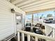 Relaxing covered porch with wicker chairs and side table at 1027 S Prospector Dr, Apache Junction, AZ 85119