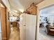 Functional kitchen with white appliances and wood cabinets at 1027 S Prospector Dr, Apache Junction, AZ 85119