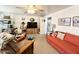 Cozy living room featuring a sofa, armchair, and TV at 1027 S Prospector Dr, Apache Junction, AZ 85119