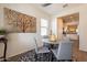 Dining area with kitchen view, round table, and gray chairs at 105 S 224Th Ave, Buckeye, AZ 85326