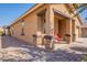 Home exterior with walkway and red chair at 105 S 224Th Ave, Buckeye, AZ 85326